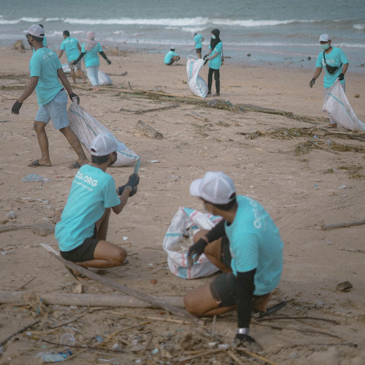 Activists picking up trash on the beach